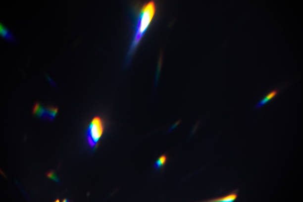 istock colorful warm rainbow crystal light leaks on black background 1318159133