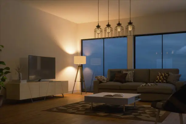 Cozy scandinavian style living room with television and furniture at night.