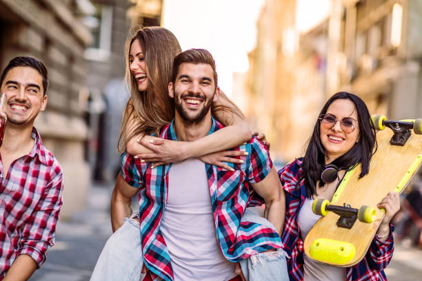 istock Hipsters drinking beer together on street 1318164237
