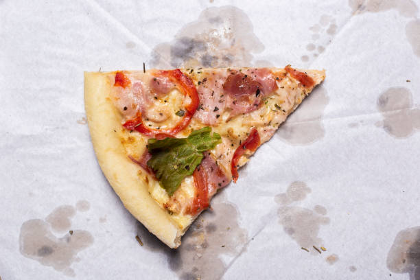 istock slice of fresh pizza on a package on a blue background. Top view, flat lay 1318165829