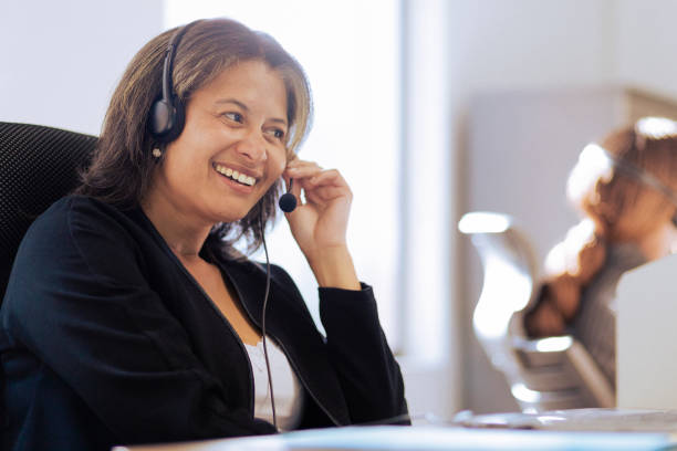 Female call center agent talking with client