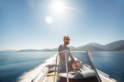 Young man yachting alone