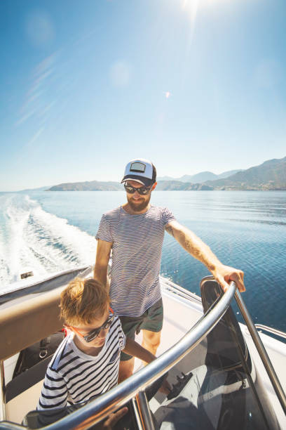 istock Father and son yachting 1318168918