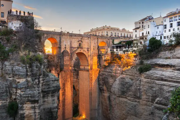 Ronda, Spain at Puente Nuevo Bridge at sunset.