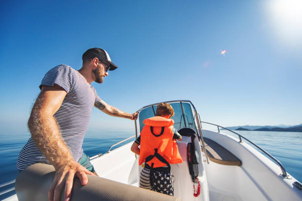 istock Father and son yachting 1318169074