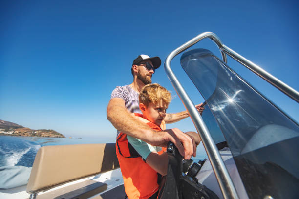 istock Father and son yachting 1318169075