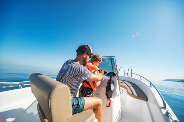istock Father and son yachting 1318169090