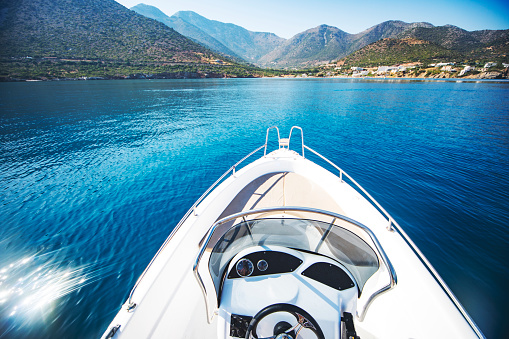 Speedboat traveling over blue sea