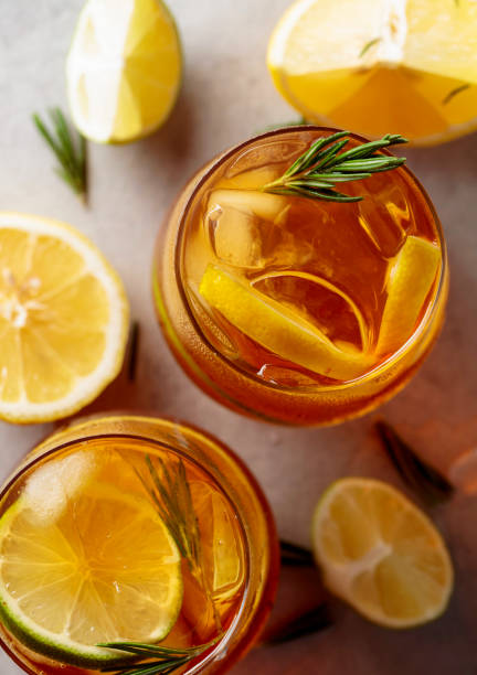 istock Iced tea with lemon, lime and ice garnished with rosemary twigs. 1318169769