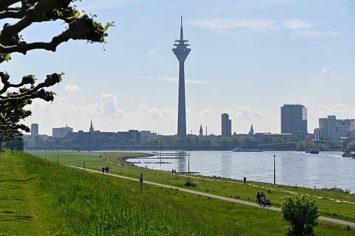 Duesseldorf, Germany, May 13, 2021 - Skyline of Düsseldorf seen from the bank of the Rhine in Heerdt