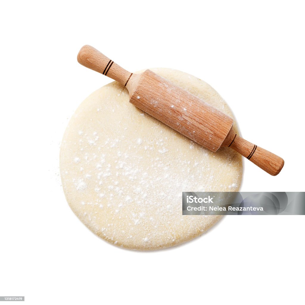 Fresh raw dough for pizza or bread Rolling pin with dough isolated on white background. top view Dough Stock Photo