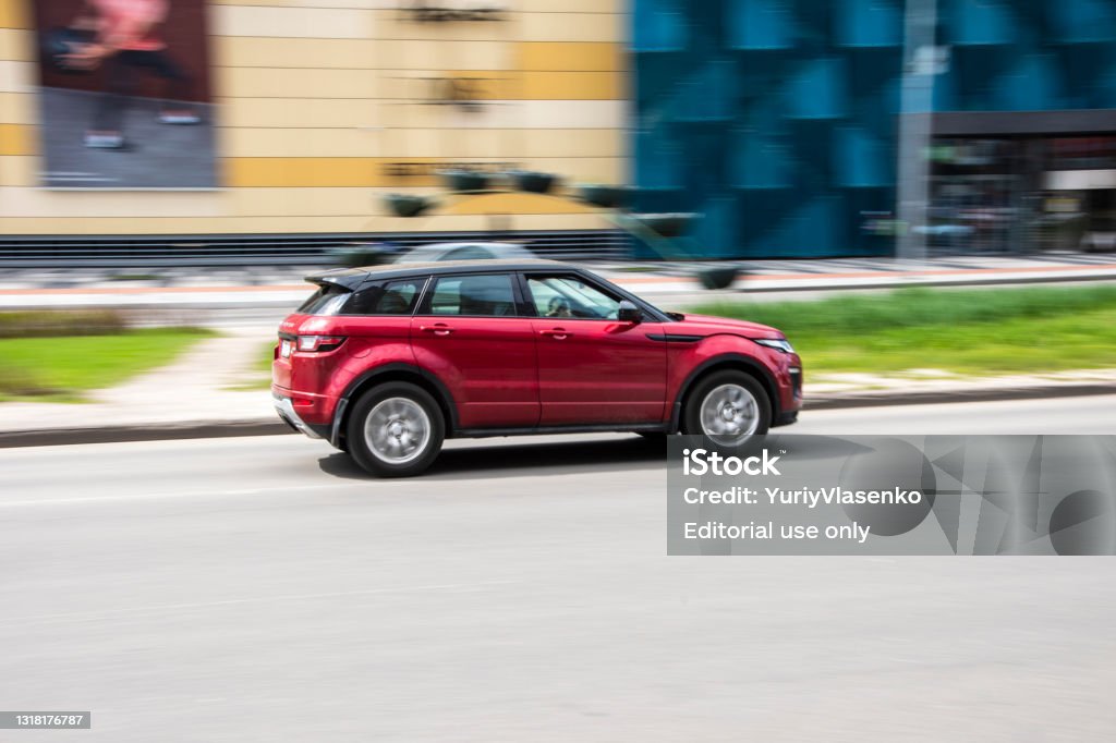 Red Land Rover Range Rover Evoque car moving on the street. Ukraine, Kyiv - 26 April 2021: Red Land Rover Range Rover Evoque car moving on the street. Editorial Land Rover Stock Photo Red Land Rover Range Rover Evoque car moving on the street. Ukraine, Kyiv - 26 April 2021: Red Land Rover Range Rover Evoque car moving on the street. Editorial Land Rover Stock Photo