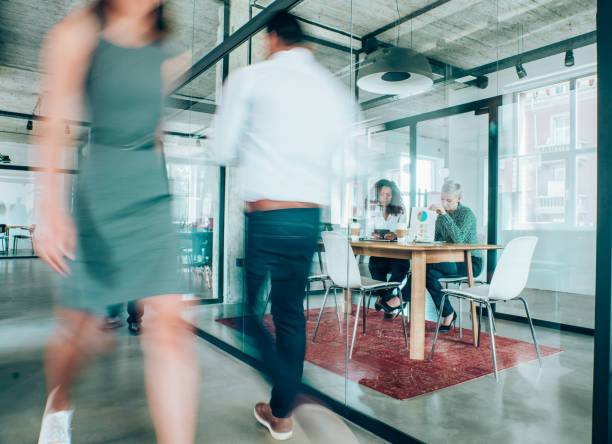istock Business meeting at busy corporate office. 1318178053