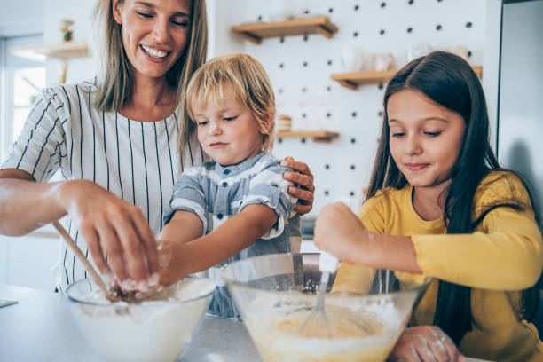 istock Family cooking together. 1318178079