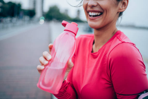 istock Sporty woman taking a break after running workout. 1318178085
