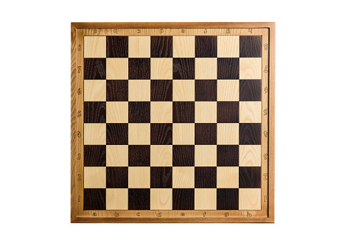 Chess board isolated on white background. Wooden chess board, shot from above.