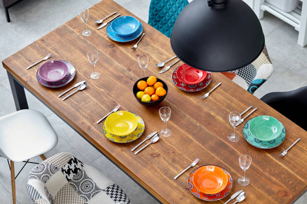 istock A modern wooden dinning table prepared for dinner. Top view. 1318179711