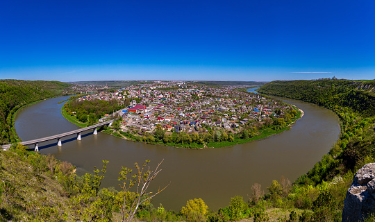 Beautiful view of the canyon with the river Dniester and the city in summer. Zalischyky