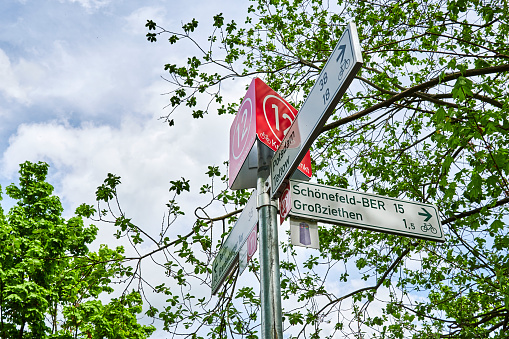 Berlin, Germany - May 15, 2021: Information sign for cyclists on the Berlin Wall Trail between Berlin and Brandenburg with various tourist destinations.