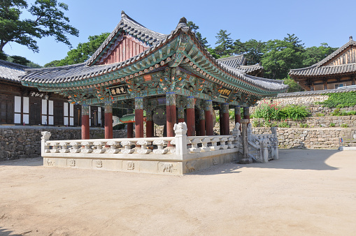 Korean buddhist temple from Silla Dynasty era. Bell Pavilion with traditional gong, bell and drum. Translation: \