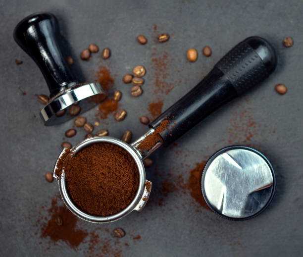 istock Portafilter with coffee and temper on table 1318185700