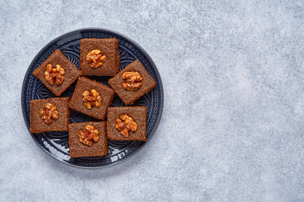 istock Middle eastern walnut semolina cake basbousa , namoora, hareesa . Traditional sweets celebration Eid , Ramadan .  Top view with copy space 1318186368