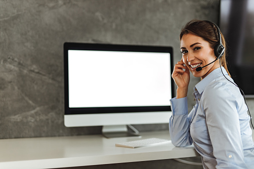 Woman posing for picture, working like an operator.