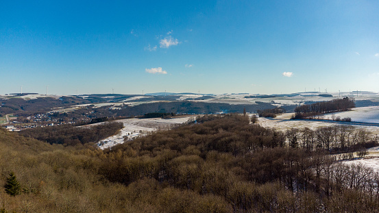 Aerial view of the landscape in the Palatinate near the town of Meisenheim in winter with snow covered farmland