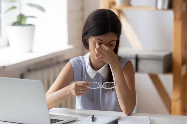 istock Tired millennial female suffer from dizziness in office 1318190029