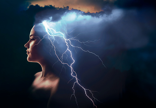 Double exposure of woman's profile and lightning.
Concept: impulsive behavior - impulsiveness