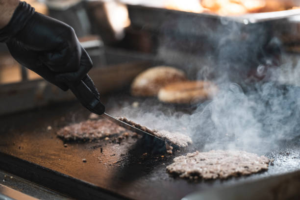 istock The chef is turning the meatballs. 1318193320