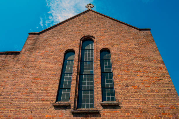 The face of the church building in London towards the blue and cloudy sky.