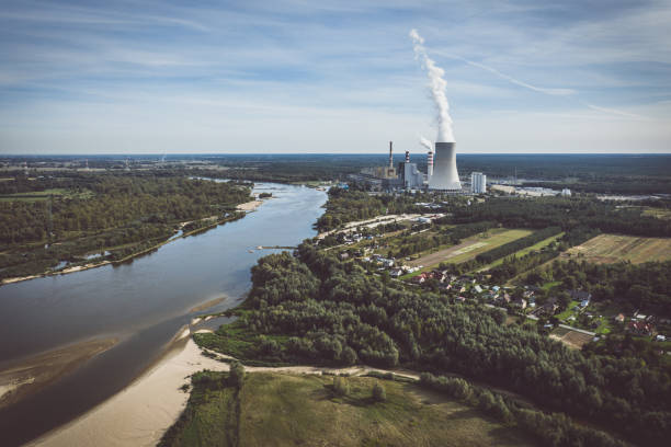istock Power station under moody cloudy sky aerial view 1318195588