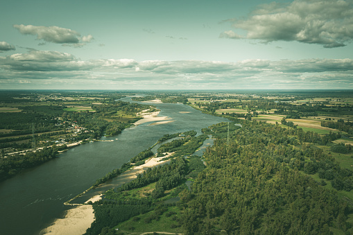 Shoals on the Vistula river under blue cloudy sky aerial view