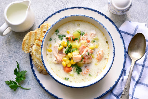 istock Chowder - thick potato soup with trout ( salmon ) and cream in a white bowl 1318197481