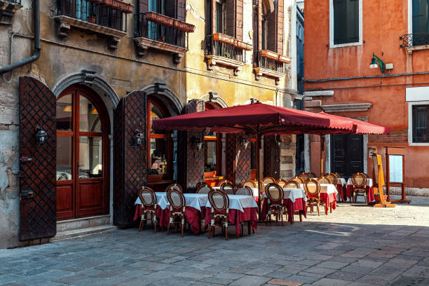 istock Outdoor restaurant on small square in Venice, Italy. 1318197621