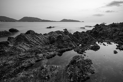 Long exposure of seascape scenery with rocks in black and white,beautiful image can be used nature composition for background and wallpaper.