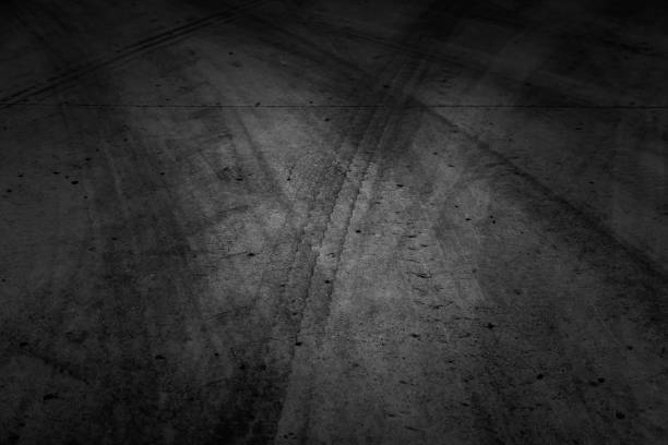 Wheel tracks on urban street, vehicle skidding, texture
