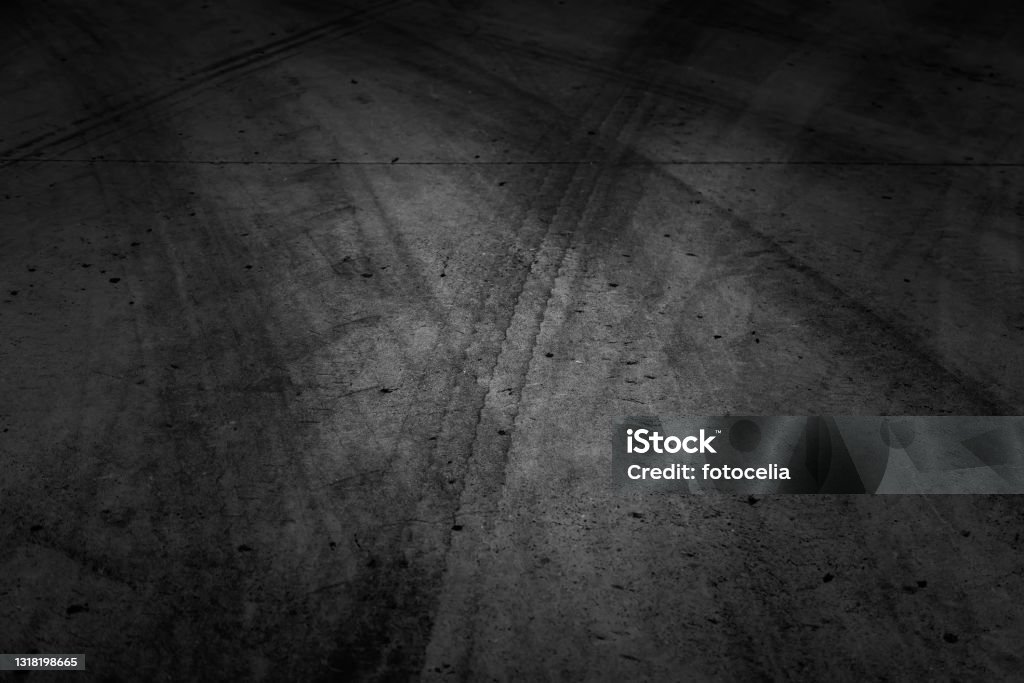 Wheel tracks on street Wheel tracks on urban street, vehicle skidding, texture Tire - Vehicle Part Stock Photo