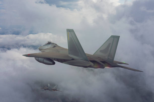 istock Jet fighters flying over the clouds. 1318199266