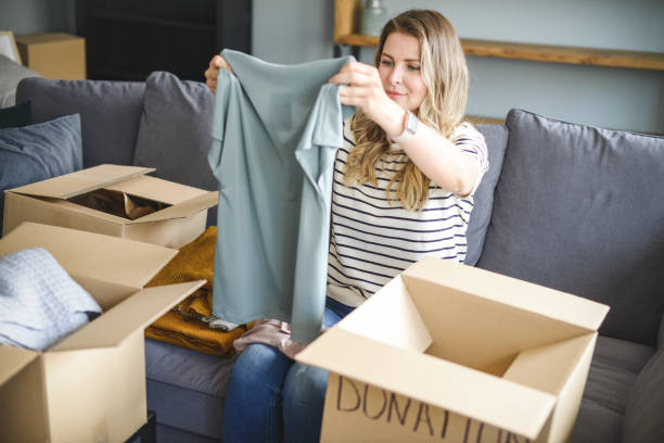 istock woman puts donations in a box 1318202197