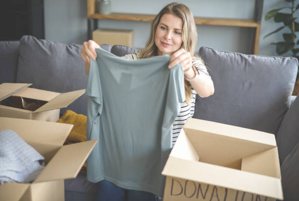istock woman puts donations in a box 1318202263