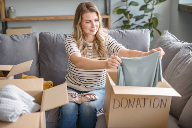 istock woman puts donations in a box 1318203041