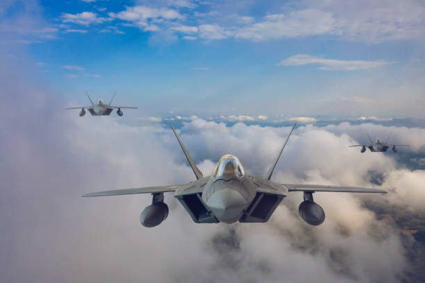 istock Jet fighters flying over the clouds. 1318204915