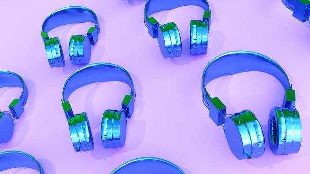 istock 3d rendering. abstract background blue headphones on pink desk 1318205475