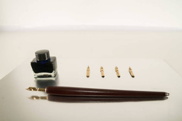 istock Antique ink pen background 1318205617