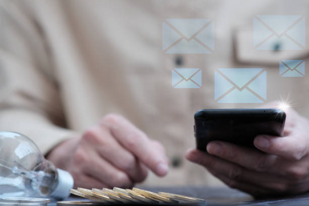istock Businessman using a mobile phone and sending emails 1318221232