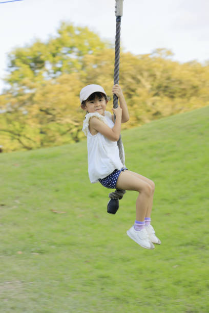 istock Japanese girl (5 years old) playing with flying fox 1318224076