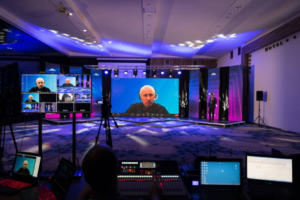 Live internet streaming of business conference meeting,online webinar or seminar via social network broadcast in new normal, covid outbreak,elearning. Live internet streaming of business conference meeting, presenter joining a seminar via video conference call in empty convention center. Online webinar or seminar via social network broadcast in new normal, covid outbreak,e-learning. live virtual event stock pictures, royalty-free photos & images