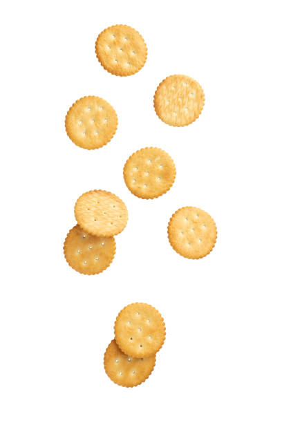 istock Cracker cookies falling isolated on white background with clipping path 1318226612